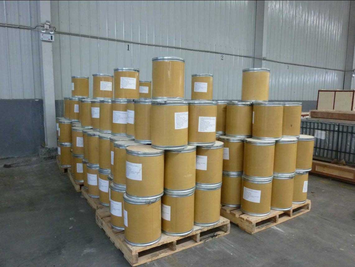 Labelled pharmaceutical material containers organised on pallets in a storage area